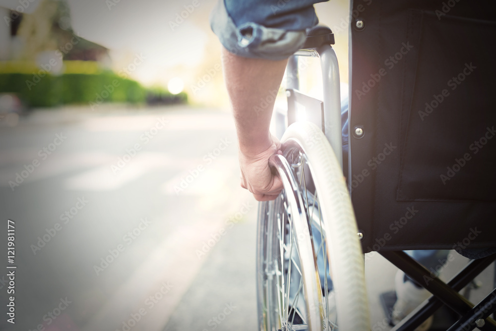 Disabled man on a wheelchair - obrazy, fototapety, plakaty 