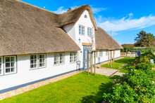 Traditional White House With Thatched Roof In Wenningsted Village On Sylt Island, Germany
