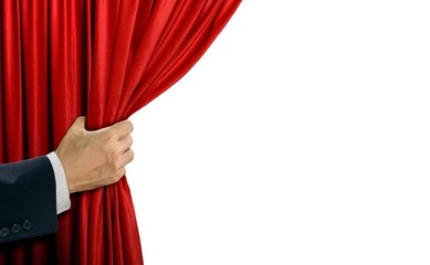 hand opening stage red curtain over white