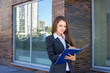 © antoshina_t - Woman holds the folder with documents and writes