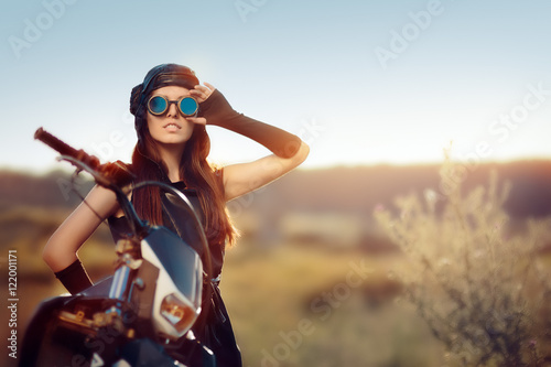 Fotografie, Obraz Cosplay Steampunk Woman Next to Her Motorcycle
