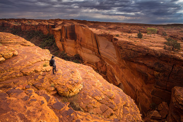 man travel in kings canyon of northern territory, australia.
