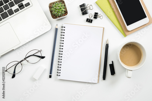 Fotografie, Tablou Notebook is on top of wood table with supplies. Top view, flat l
