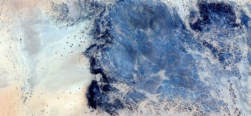 stone head,abstract landscapes of deserts ,Abstract Naturalism,abstract photography deserts of Africa from the air,abstract surrealism,mirage in Sahara desert,fantasy forms of stone in the desert
