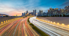 Movement Of Car Light With Singapore Cityscape Skyline During Sunset