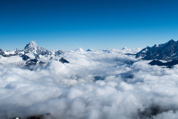 Mountain peaks above the clouds