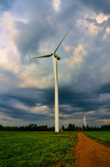 Impressive clouds on the top of wind turbine