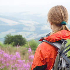 Wall Mural - young woman hiking in the mountains