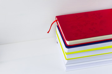 A stack of books on white background. Copy space for your text. Ideas for business and self-development