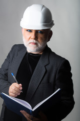 Man in hard hat with notebook