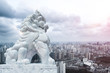 stone lion and cityscape and skyline of shanghai