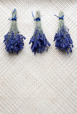 Fototapeta Lawenda - Bunch of Lavender on straw mat.
