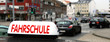 Banner Fahrschule Schild mit Stadtszene