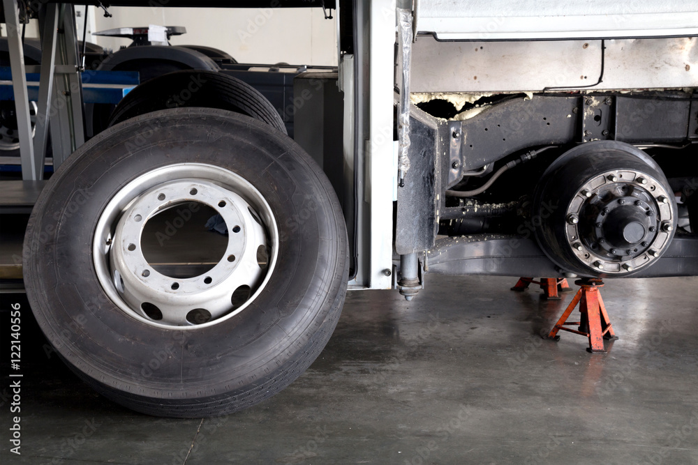 Bus Rear Wheel Frame bus spare wheel tire waiting to change and axle bus on the lifti Stock ...