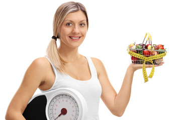 Sticker - Woman holding a shopping basket and a weight scale