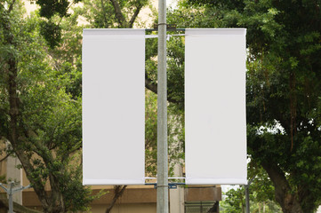 large blank billboard on a street wall, banners with room to add your own text