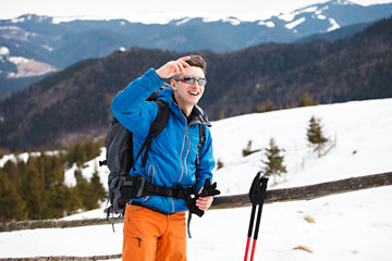 Wall Mural - Hiker in winter mountains