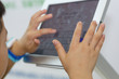 Children's hands and tablet computers