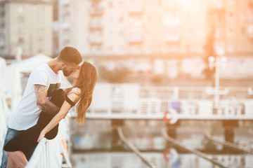 couple kissing against the backdrop of the city