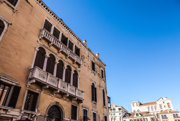 VENICE, ITALY - AUGUST 17, 2016: Famous architectural monuments and colorful facades of old medieval buildings close-up on August 17, 2016 in Venice, Italy.