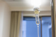 © mikumistock - Close up saline solution drip for patient and infusion pump in h