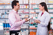 © JackF - Pharmacist and customer in drugstore .