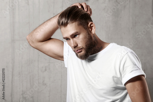 Fotografie, Obraz Handsome bearded man in a blank white t-shirt with stylish hair
