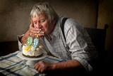 Lonely elderly man on birthday