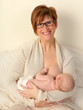 Breastfeeding baby in bed