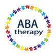inscription ABA therapy and colored puzzles on a white background .