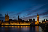 Fototapeta Big Ben - Big Ben and the Houses of Parliament at night from across the river Thames and Westminster bridge southbank in London, England, UK
