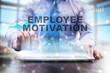 © WrightStudio - Businessman is using tablet computer, pressing button on touch screen and selecting 'Employye motivation'.