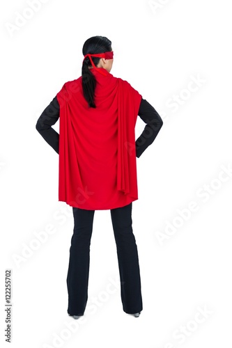 Fotografie, Obraz Rear view of woman pretending to be a super hero