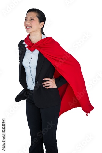 Fotografie, Obraz Woman pretending to be a super hero on white background