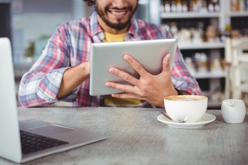 Poster - Man using digital tablet