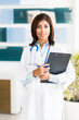 Young Woman Hispanic Doctor Nurse in Office