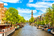 Scenic Amsterdam canal with houseboats