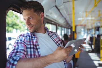 Poster - Handsome man using digital tablet