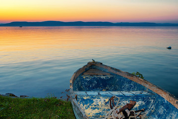 Wall Mural - Lake Balaton in Hungary after sunset with a boat in the front