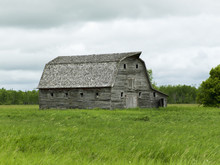 Old Wooden Barn In A Grass Field, Manitoba, Canada