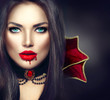 © Subbotina Anna - Halloween vampire woman portrait. Sexy vampire girl with dripping blood on her mouth