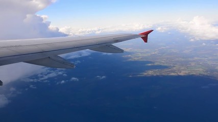 Wall Mural - the view from an airplane window on sky with cloud.