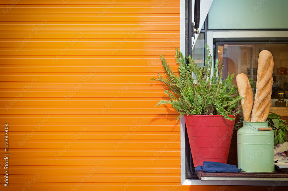 Orange Container wall with flowerpot and bread ,Wall with orange ...