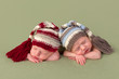 Identical twin babies with hats