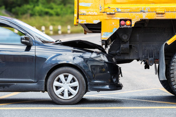 Wall Mural - Accident on the road involving black car and yellow truck