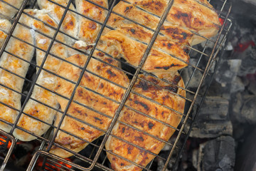 Chicken fillet and sausages on the grill BBQ grill for roasting