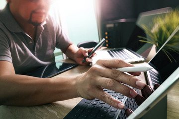 Wall Mural - Outsource Developer working on marble Desk Working Laptop Comput