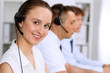 © rogerphoto - Call center. Focus on beautiful woman in headset