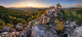 Fototapeta Do pokoju - Sunset in forest with rocky mountain hill