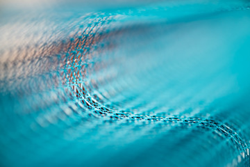 abstract curved grid background model of wavy surface blue color